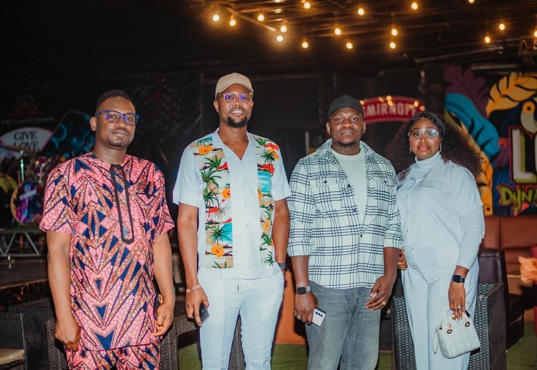 Four alumni posing at the reunion