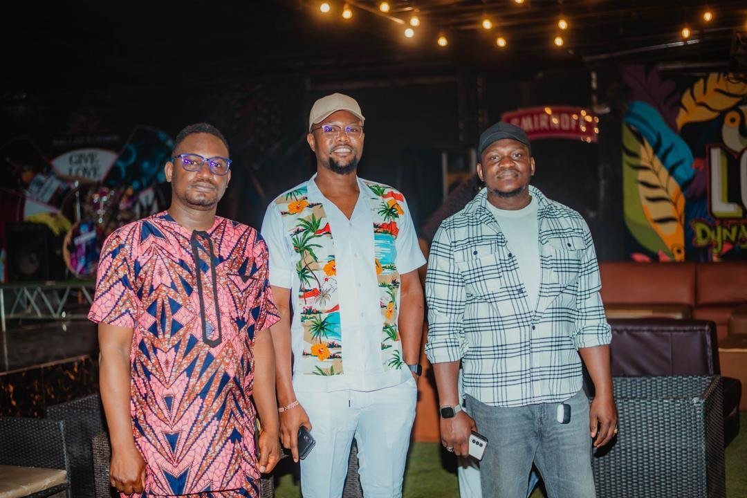 Three alumni posing together